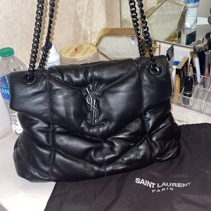 All black puffy bag